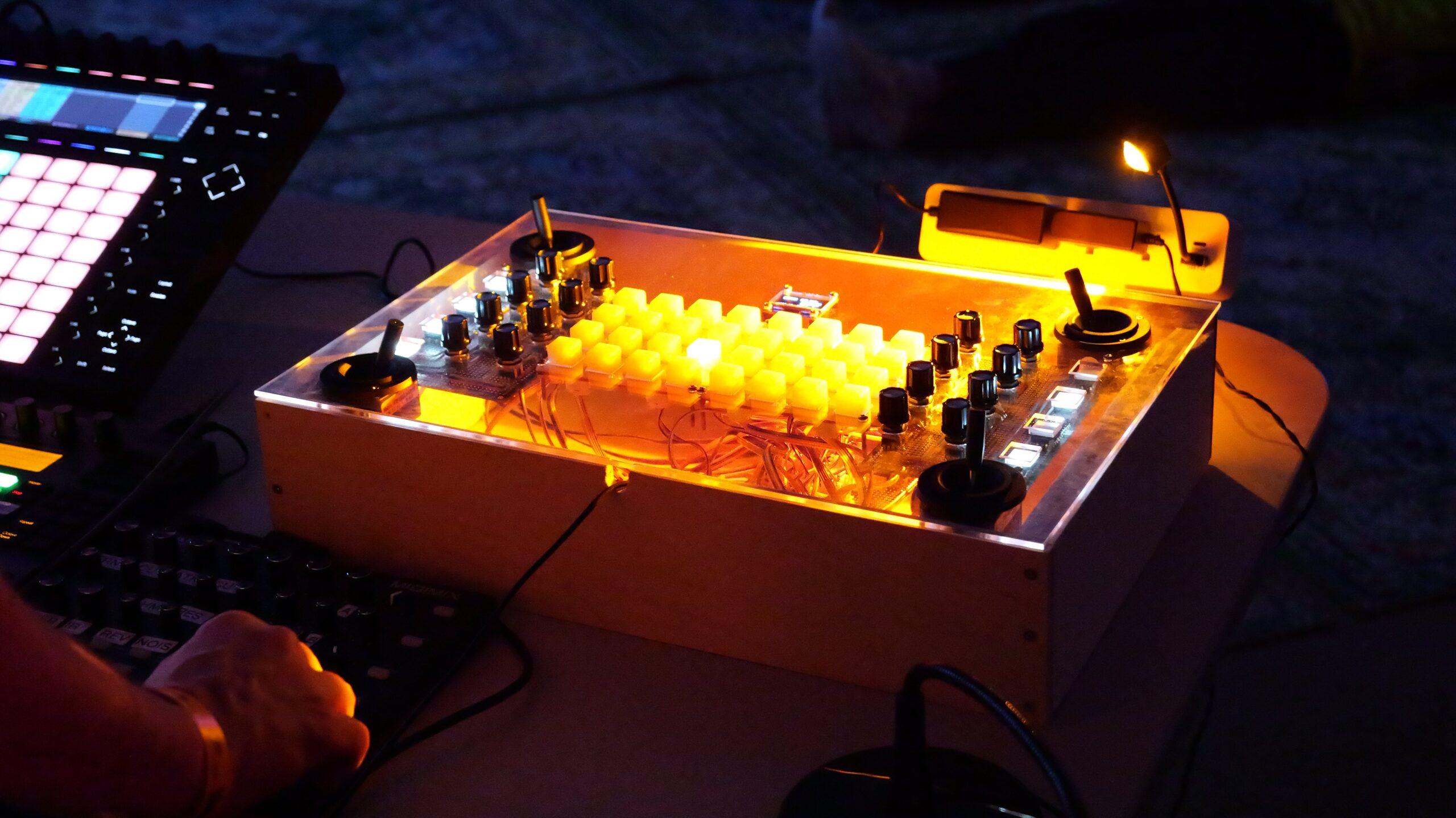 Ben Globerman performing Hum's Codex in a dark gallery space